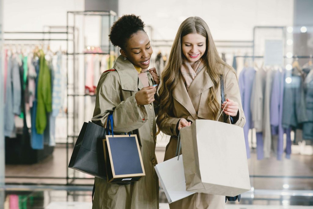 happy friends shopping together
